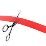 Illustration of scissors and red ribbon on a white background